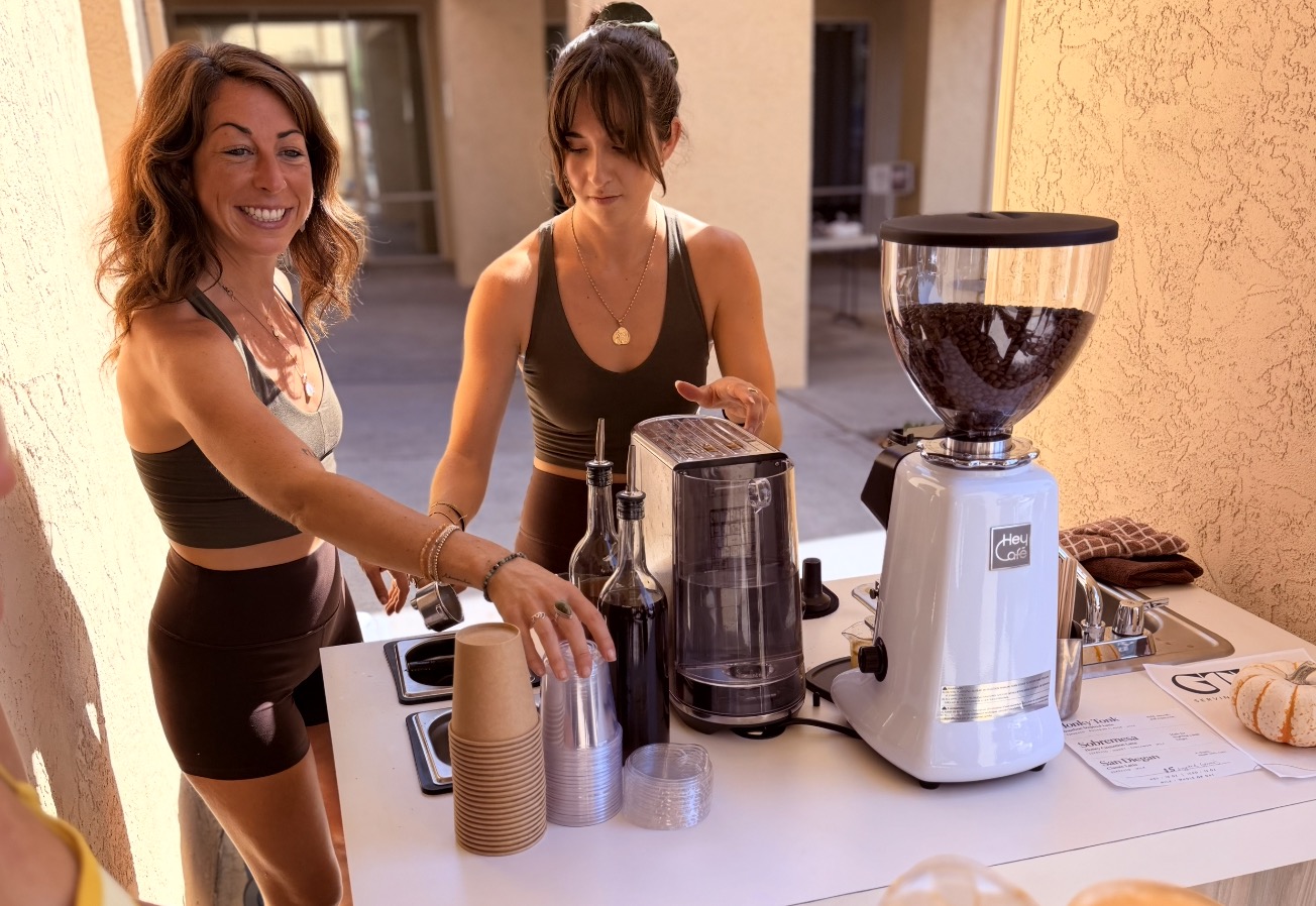 Makayla and Briana preparing coffee at the GTHR cart